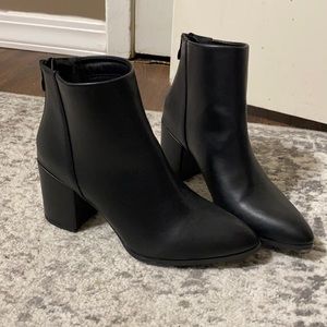 she&in black heeled boots